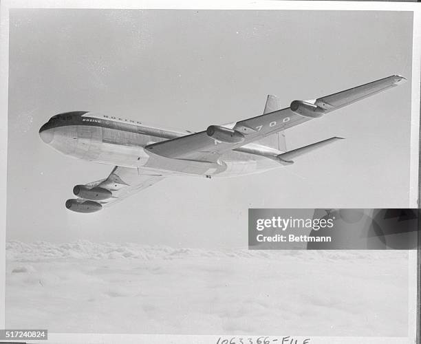 This photo shows the Boeing 707 jet prototype cruising high above the clouds during the initial phase of its flight test program. It also was...
