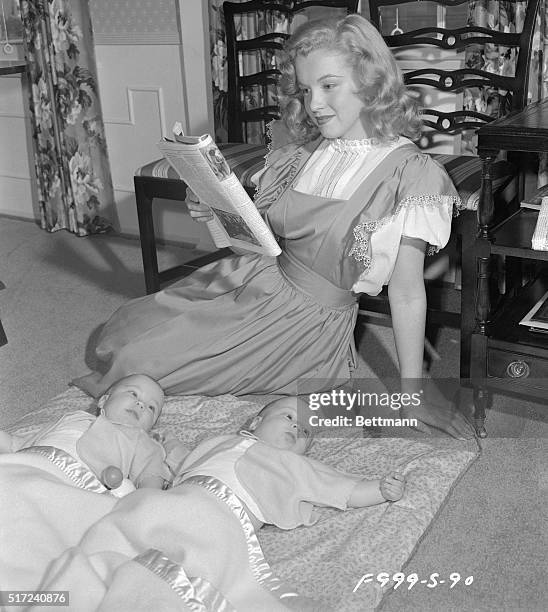 The babysitter in this photo is Marilyn Monroe. Females have been making males do things they didn't want to do since the beginning of time, and so,...