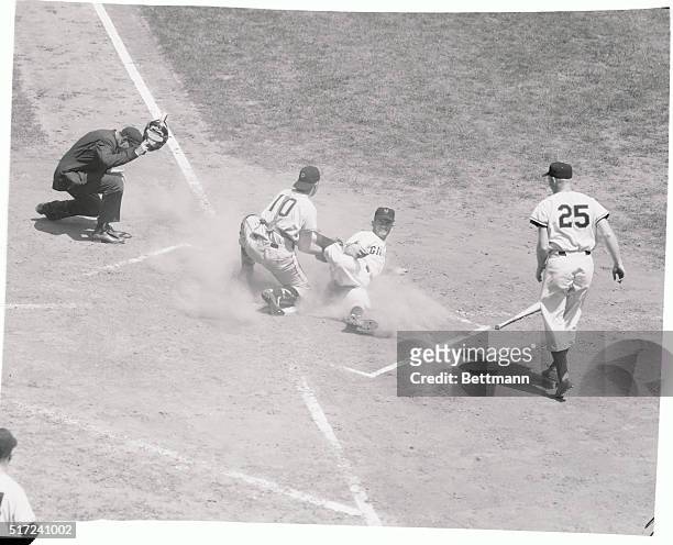 Giant second baseman Dave Williams is tagged out at home by Pittsburgh catcher Jack Shepard in the second inning of the game at the Polo Grounds July...