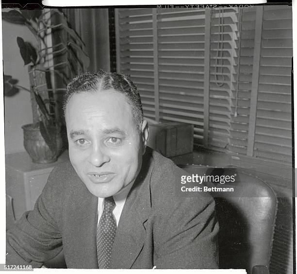 Government investigating board announced on May 28 that there was no doubt as to the loyalty of Dr. Ralph Bunche, shown here in his office located in...
