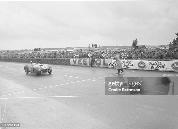 Win Grand Prix Endurance Race. Le Mans, France: A Ferrari driven by the team of Argentina's Jose Froilan Gonzales and France's Maurice Irintignant...