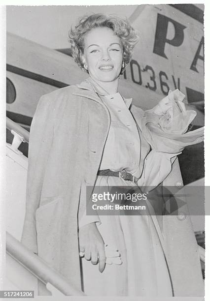 Television Actress Maria Riva boards a Pan American Airlines plane at International Airport, July 19th, enroute to London where her fabulous mother,...