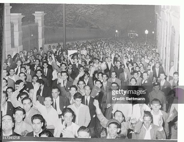 With cries of "Goa is ours," thousands of Lisbon Males crowd the street of July 24th before the residence of Prime Minister Salazab. Protesting...