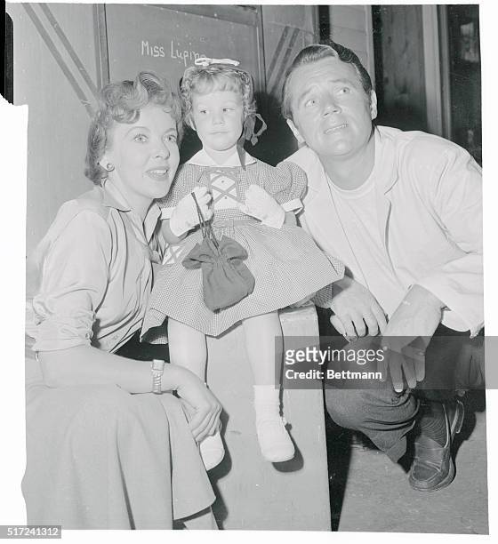 Bridget Duff seems unimpressed by her famous parents, Ida Lupino and Howard Duff, or the cameraman about to take pictures, as she visits the movie...