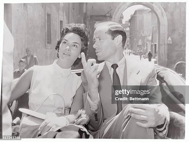 It takes an out-of-towner to show a native the sights. At least that's what U.S. Actor Mel Ferrer seems to be doing as he escorts lovely Italian...