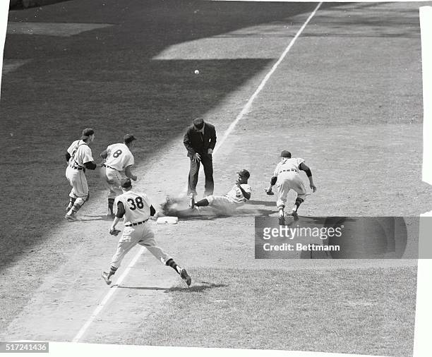 Despite the assistance from most of the Detroit Tigers infield, Cleveland Indians outfielder, Al Smith, not only slid safely into third base, but on...