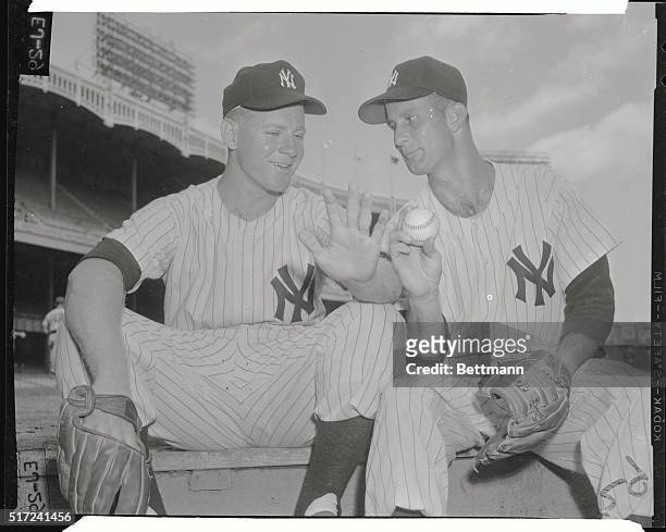 Two younger members of the New York Yankee mound corps sit on the steps of the dug-out in Yankee Stadium prior to the August 12th twin-bill with the...