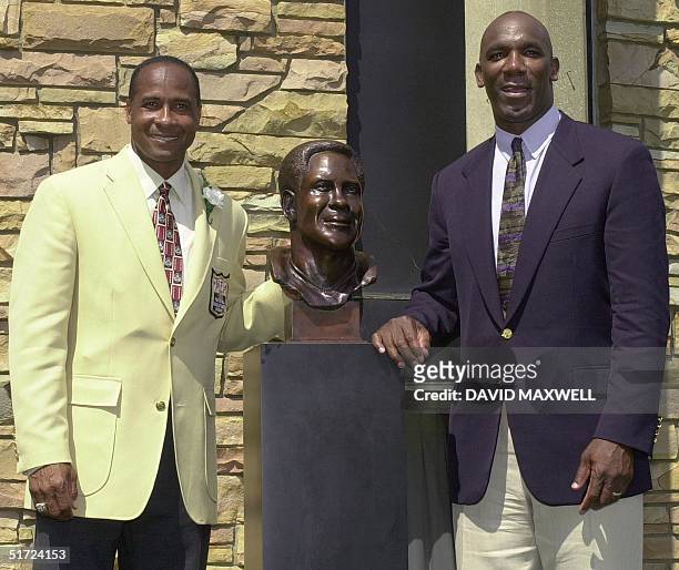 Pro Football Hall of Fame enshrinee Lynn Swann stands with his presenter, former Pittsburgh Steelers' teammate John Stallworth during the...
