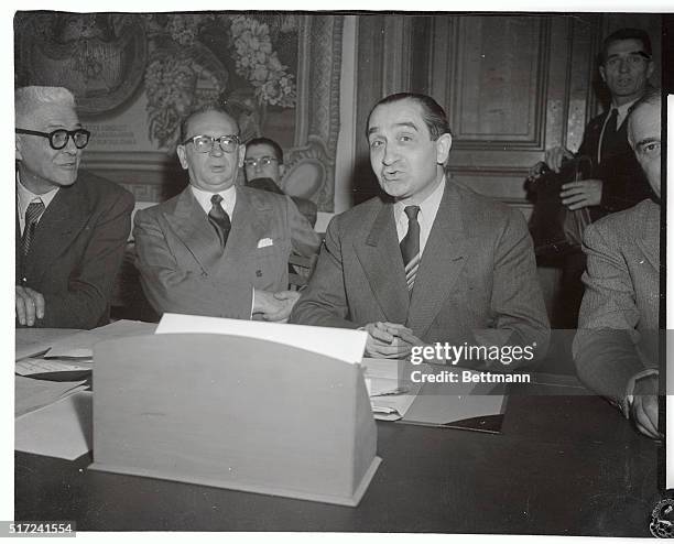 France's Premier Pierre Mendes-France is shown with his finance minister, Edgar Faure, prior to the meeting of the Premier's cabinet. Having gained...