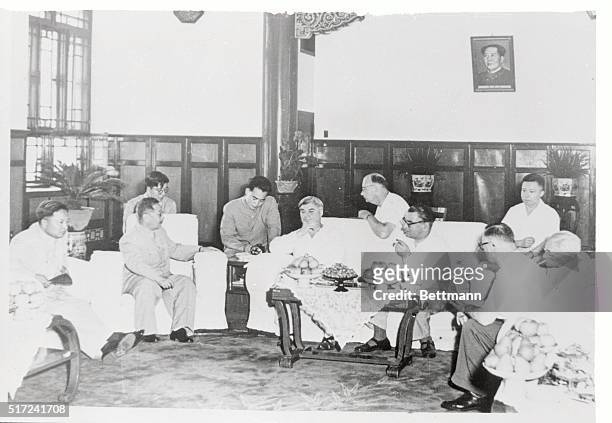 Aneurin Bevan and other members of the British Labor Party delegation visiting Red China chat with Communist officials of the Ministry of Foreign...