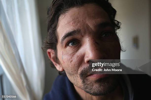 Heroin user stands after injecting himself on March 23, 2016 in New London, CT. Communities throughout New England and nationwide are struggling with...