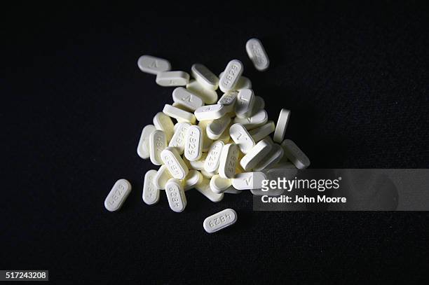 Oxycodone pain pills prescribed for a patient with chronic pain lie on display on March 23, 2016 in Norwich, CT. On March 15, the U.S. Centers for...