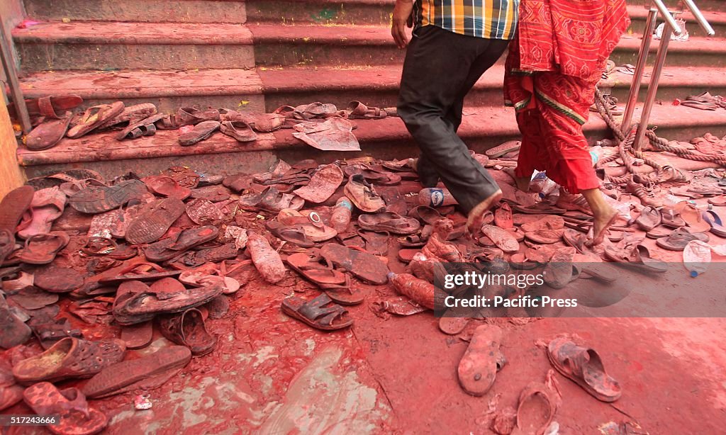 Indian hindu devotees shoes and slippers at Radha Rani...