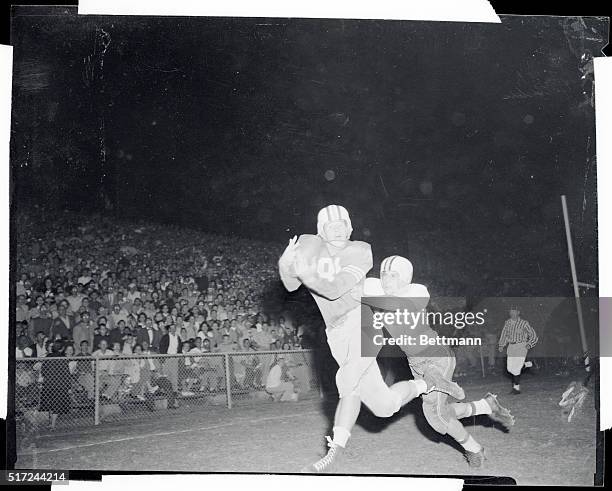 Bob Nolan, Miami left end, catches a touchdown pass in the end zone thrown by quarterback Mario Bonofiglio in the second quarter of the game at...