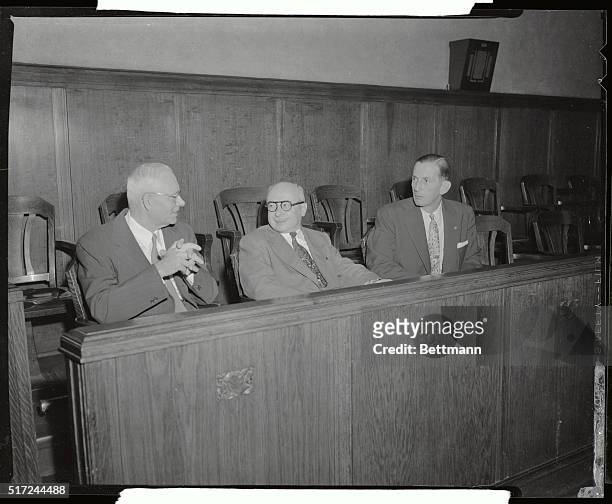 Prosecution attorneys relax in the jury box prior to the opening of the fourth day of the trial of Dr. Samuel Sheppard October 21st. Left to right...