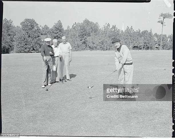 Charles "Chick" Evans, of Chicago, gets ready to drive off the first tee at the Pinehurst Country Club in practice for the North and South Seniors...