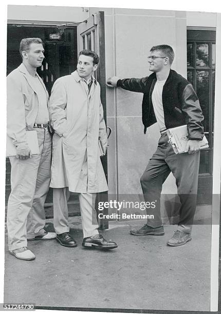 Len Dawson , Purdue's brilliant sophomore passer, talks over the Boilermakers' next game with two freshmen halfbacks during a break between classes....