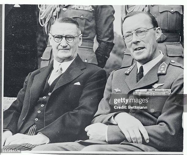 Prince Bernhard of the Netherlands, chats with Dr. E.G. Jensen , Governor General of South Africa after he flew his own plane from Holland. The...