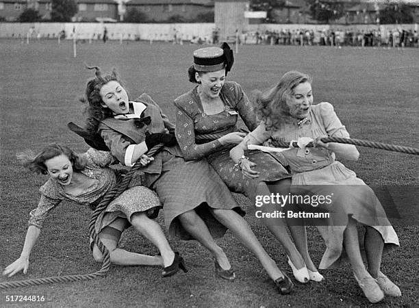 London, England- Pride at winning commeth before the fall for these four movie actresses of the J. Arthur Rank orginization. They won the tug-o-war...