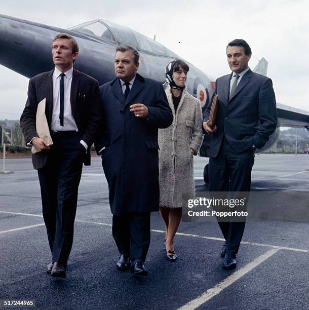 The cast of the television series 'The Plane Makers' pictured in front of the experimental aircraft, Scott-Furlong Predator in 1964. From left to...