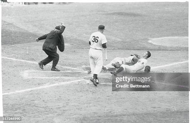 Off With His Hat. New York: Yankee player Billy Martin loses his hat as he is nabbed at home on an attempted steal in the sixth inning of the World...