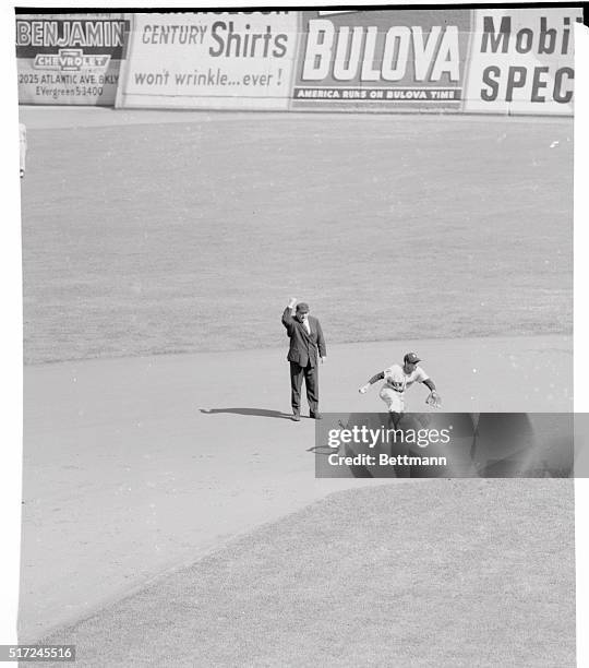 Using Force. New York, New York: Yankee shortstop Phil Rizzuto leaps over Dodger Pee Wee Reese after the latter was forced at second in the first...