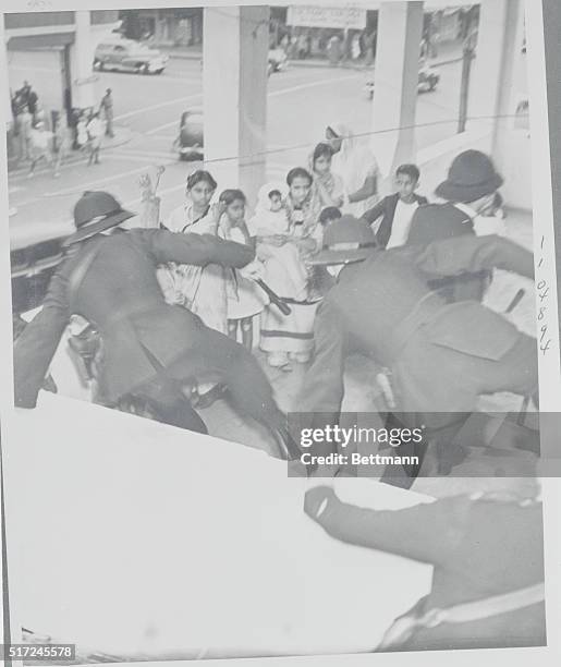 Durban, South Africa: Police Leap To The Rescue In Durban Race Rioting. Policemen leap to the rescue in an effort at saving the lives of Indian women...