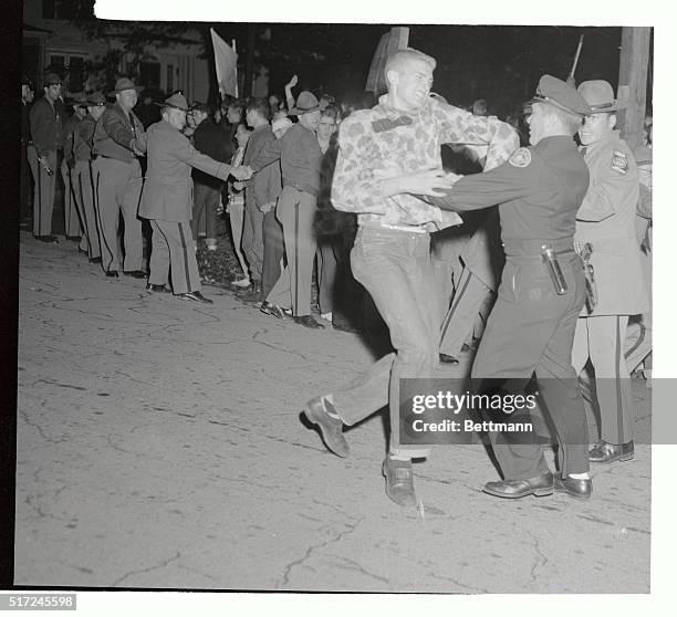 An unidentified Georgia Tech student battles an Atlanta police officer during a demonstration by some 2,000 students protesting efforts by Georgia...