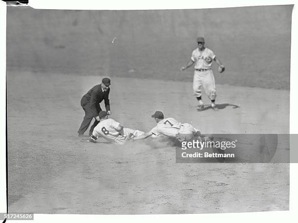 Yogi Berra, Yankees right fielder, is put out at 2nd base by Michaels of White Sox. Umpire watching is McGowan. The Yankees won, 7-2.