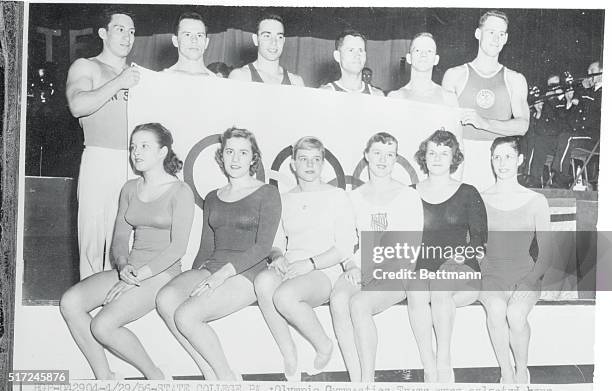 Posing with an Olympic banner are winners in the U.S. Olympic Gymnastic Team Tryouts at State College, PA. Selected April 28th were: women --Muriel...