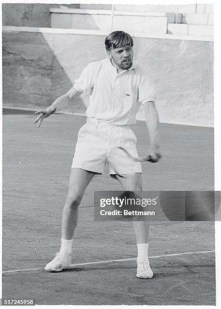 Bearded Danish tennis ace Torben Ulrich gives a quick return via the backhand route during the Roman International Tennis Championships here. Some of...