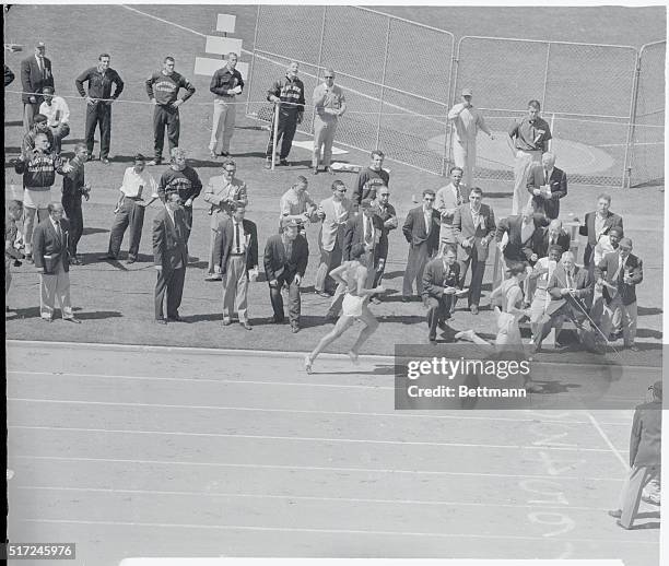 Jim Bailey , an Australian currently attending the University of Oregon, races past world mile record holder John Landy, also of Australia, to break...