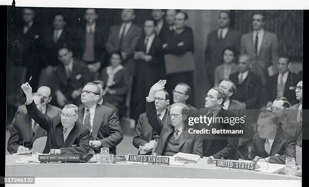 Soviet Delegate Arkady A. Sobolev, , and sir Pierson Dixon, , of England vote for the admission of Outer Mongolia, as the U. S. Delegate, Henry Cabot...