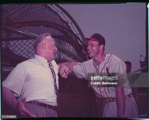 Frankie Frisch, also known as the "Fordham Flash," the famous second baseman with the Cardinals and Giants, laughs with Stan Musial.