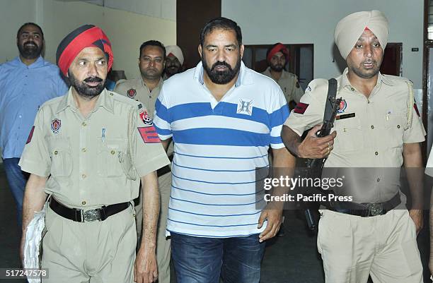 International drugs smuggler Arjuna Awardee wrestler Jagdish Bhola , escorted by Jail Guards to appear in CBI Special Court.