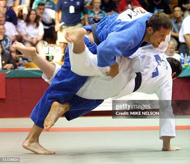 Ryan Reser of the U.S. Takes down Tom Hill of Australia during the finals match of the 73 kg Men's category during the 2001 Pacific Rim Judo...