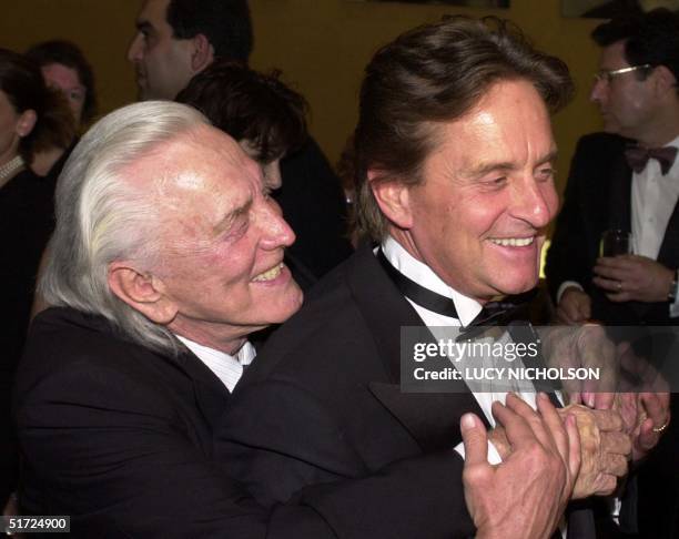 Actor Kirk Douglas hugs his son, actor/producer Michael Douglas, as they arrive at the Simon Wiesenthal Center Museum of Tolerance National Tribute...