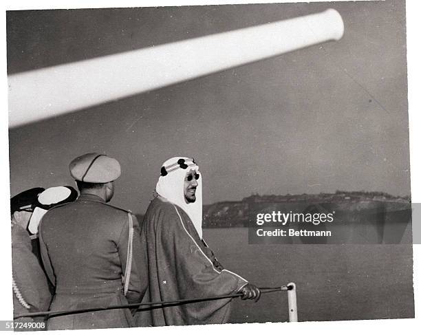 New York, New York- King Ibn Saud, of Saudi Arabia, looks toward the shore from aboard the US Destroyer, Wallis A. Lee, after transferring from the...