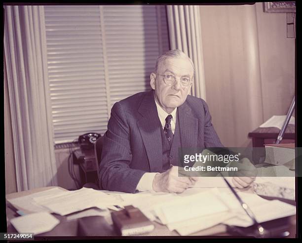 Washington, DC: John Foster Dulles at his Washington, DC desk, January 21 after being sworn in as Secretary of State.