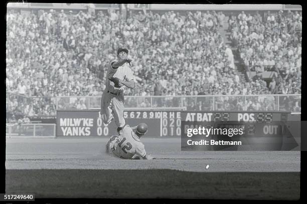 Keystone Ballet. New York: With the grace and agility of a ballet dancer, Yankee second baseman Gerry Coleman leaps high in the air and kicks to...