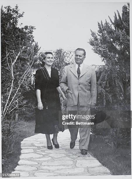 President Tito and Mrs. Jovanka Broz walk in the garden of the Presidents summer resort on the Island of Brioni on his 65th Birthday.