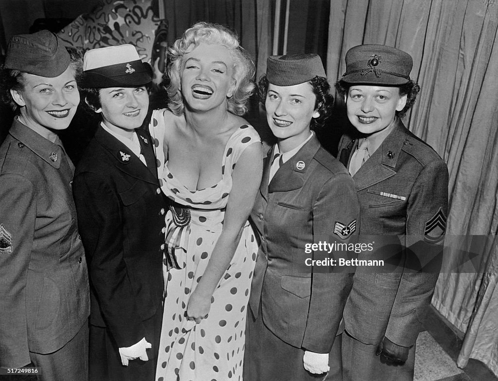 Marilyn Monroe Posing with Women of The Armed Forces