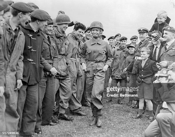 It's eyes right, eyes left, eyes up and eyes down as these Royal Air Force boys get a close look at French screen star Brigitte Bardot here April...