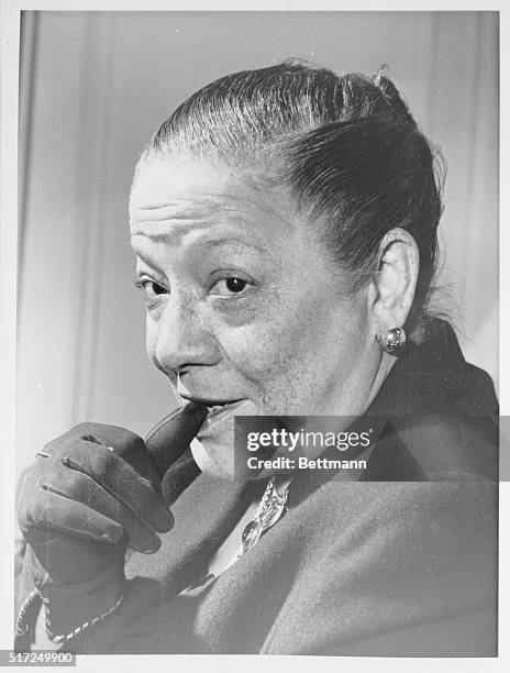 In town for a brief holiday, cigar-smoking Madame Duconge, known throughout continental cafe society as "Bricktop" gave a press conference at the...