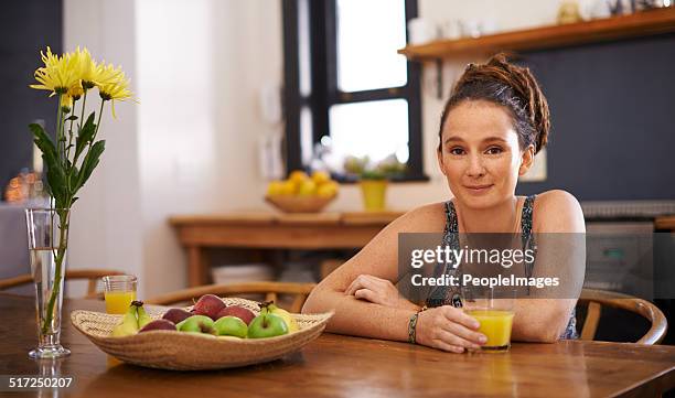 sitting down to a glass of oj - peopleimages stock pictures, royalty-free photos & images