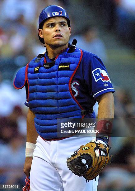Texas Rangers catcher Ivan "Pudge" Rodriguez leaves the field during early game action versus the Seattle Mariners at the Ballpark in Arlington in...