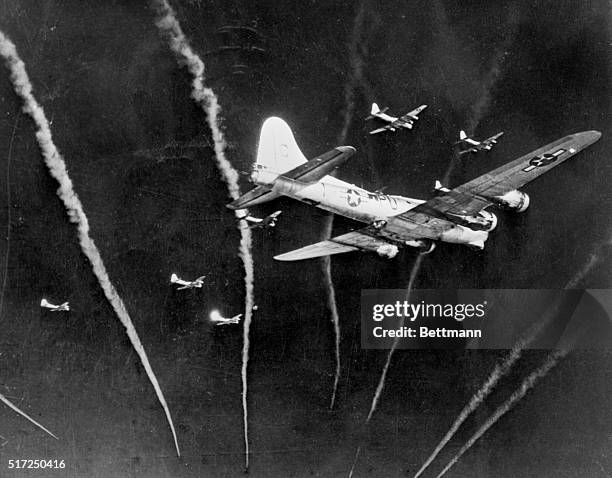 Germany: Protection In The Sky--This unusual photograph shows vapor trails from U.S. 8th Air Force fighters streaking through the skies above and...