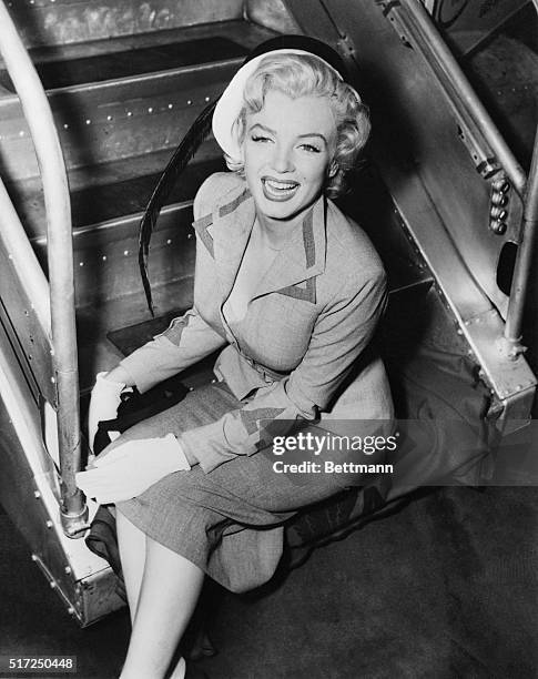 Film actress Marilyn Monroe says "Hello" to New York after arriving at La Guardia Airport from Hollywood. Her brief stay in New York will be devoted...