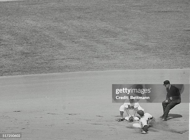 Brooklyn, N.Y.: For the second time in the first inning of the second 1952 World Series game a Yankee is thrown out trying to steal second base....