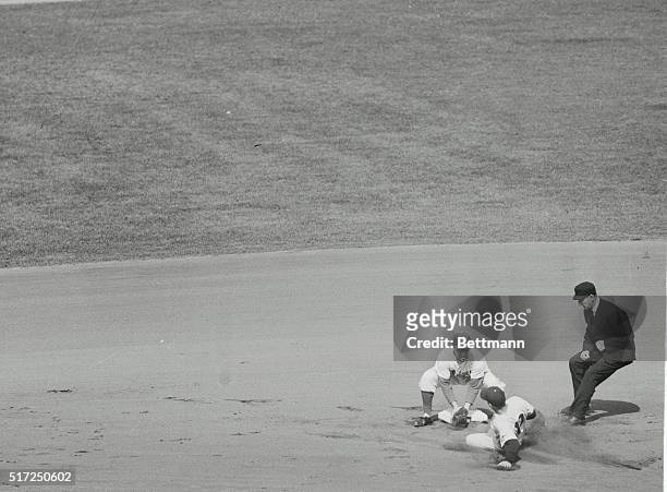 Brooklyn, N.Y.: For the second time in the first inning of the second 1952 World Series game a Yankee is thrown out trying to steal second base....